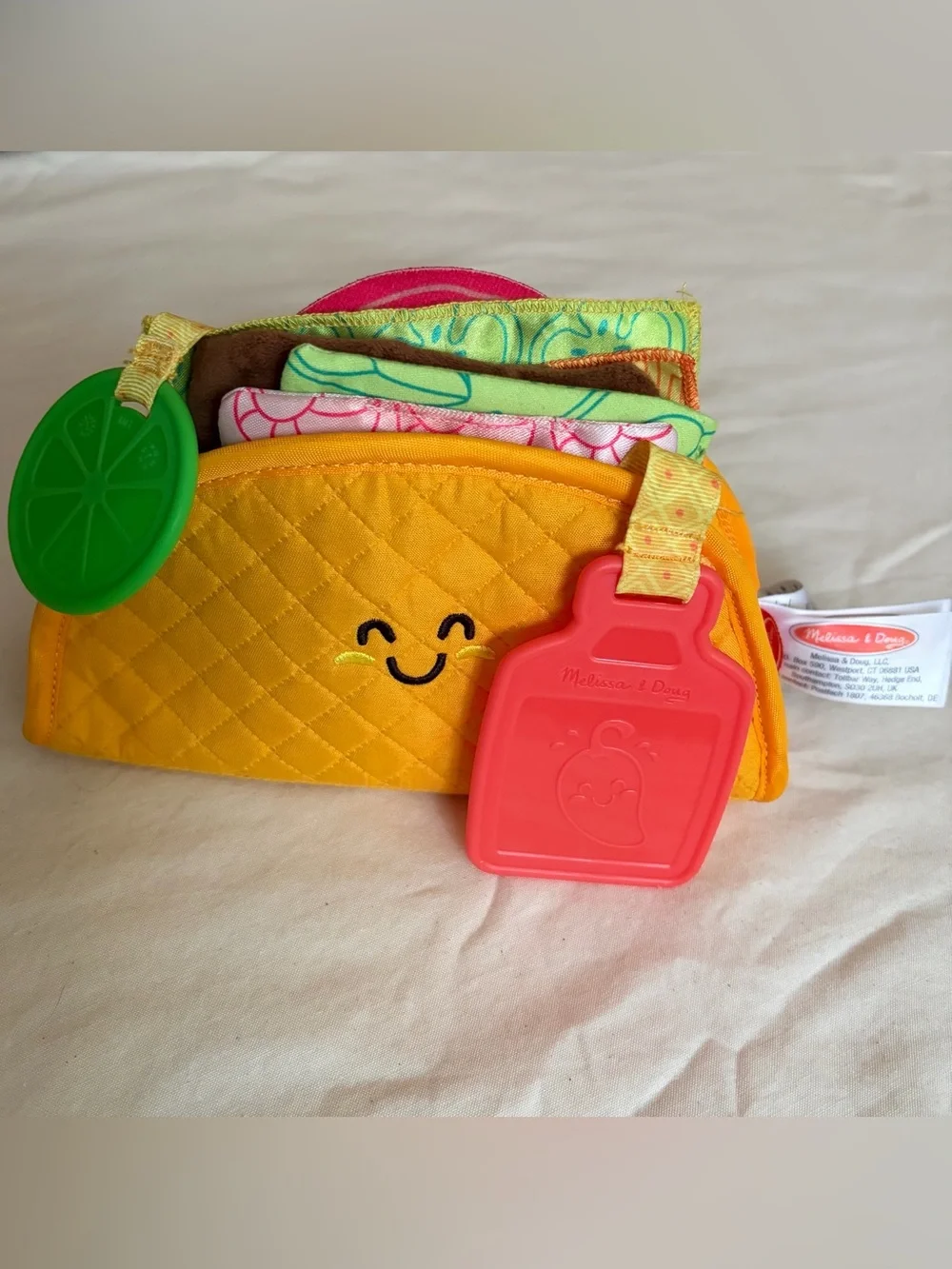 Melissa & Doug Multi-Sensory Soft Taco Fill and Spill Baby toy